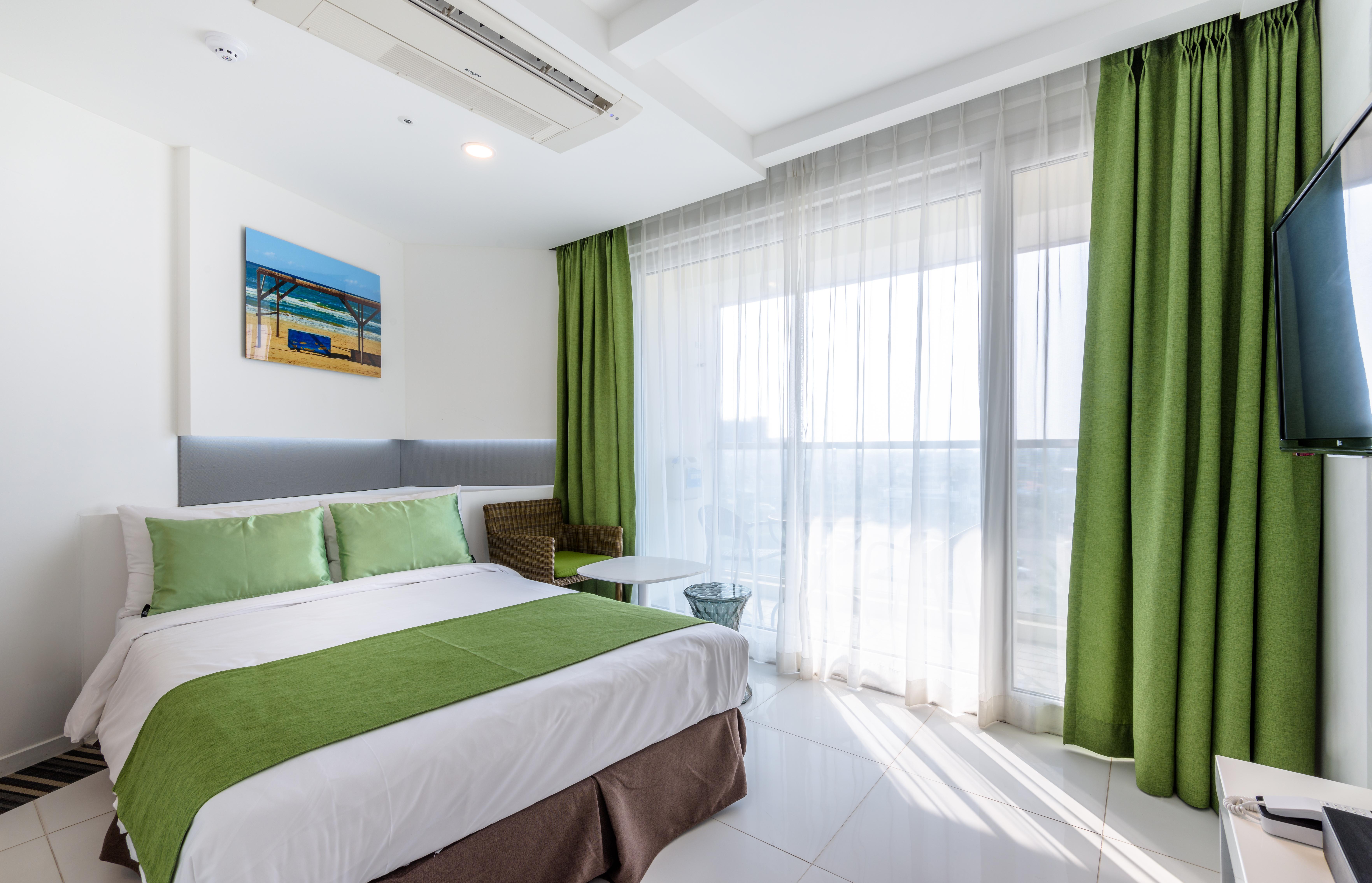Aimi Jeju Beach Hotel Екстер'єр фото